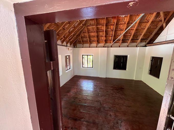 Upper floor room with wooden flooring